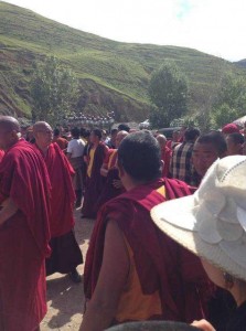 Khen Rinpoche, the abbot of Nyatso Monastery (facing front on left) along with other senior monks mediating with local Tibetans and armed police.