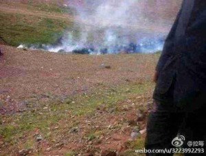 Tibetans duck for cover as armed police shoot teargas during protest against illegal mining in Dzatoe County