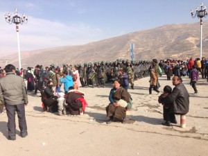A huge contingent of armed police surround Tibetans attending the Monlam Chenmo prayer festival in Rebkong County in February 2013