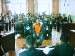 A TV grab shows Tsultrim Gyatso inside the court during the trial on 21 May 2009