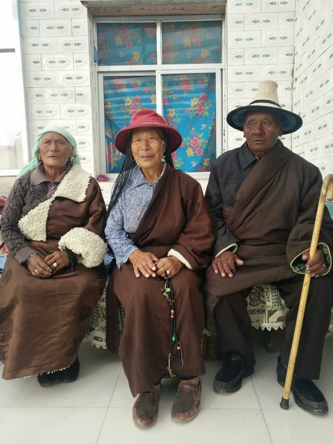 Tsegon Gyal's mother Tsewang Kyi (left), aunt (middle) and father Tselo (right)