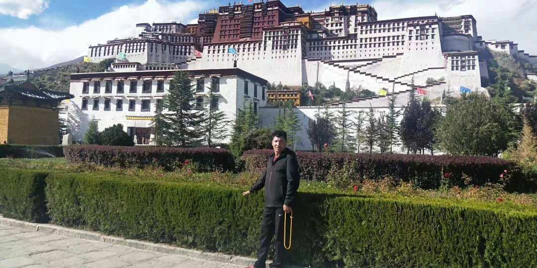 An undated photo of Lhadar on a pilgrimage trip to the Potala Palace in Lhasa.